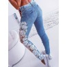 Sexiga skinny jeans - cut-out byxor med blommig spets