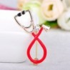 Stethoscope shaped brooch with crystal