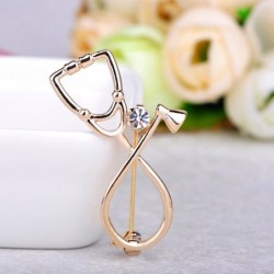 Stethoscope shaped brooch with crystal