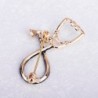 Stethoscope shaped brooch with crystal