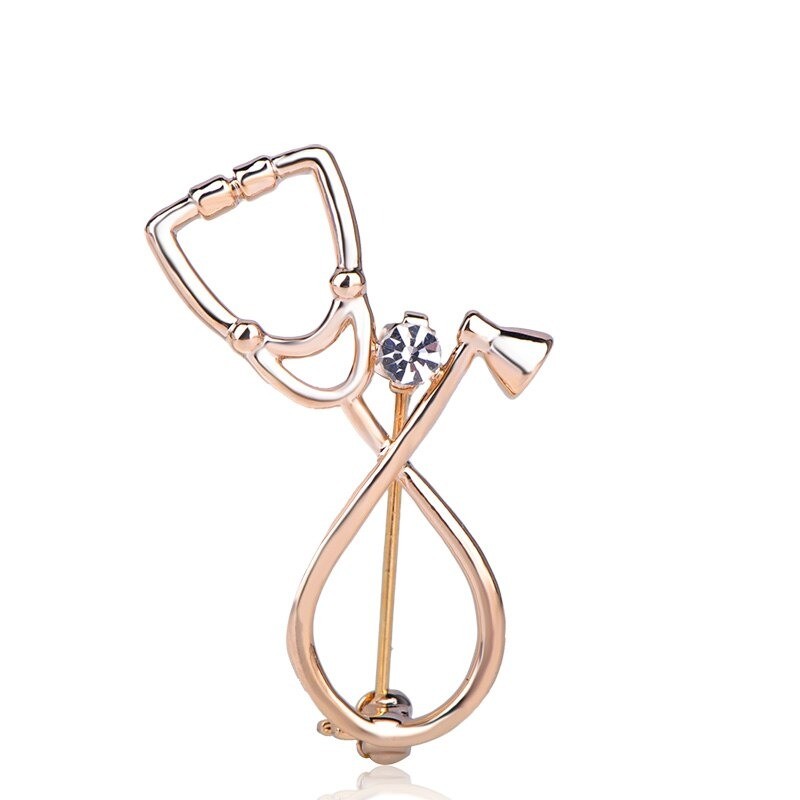 Stethoscope shaped brooch with crystal