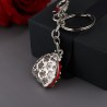 Nyckelring i metall - med nyckelpiga / strass